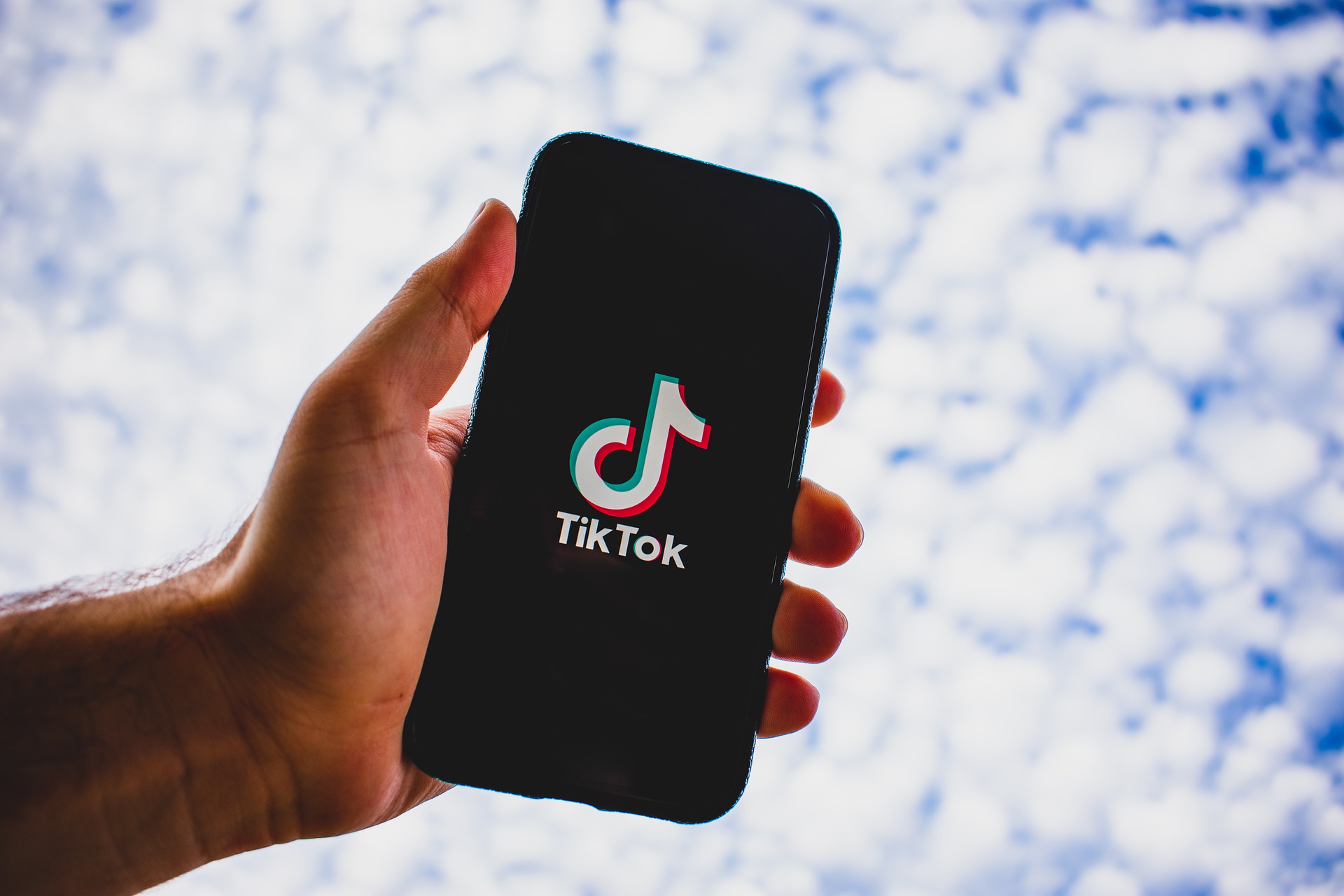 TikTok Logo on a Smartphone Device facing the sky