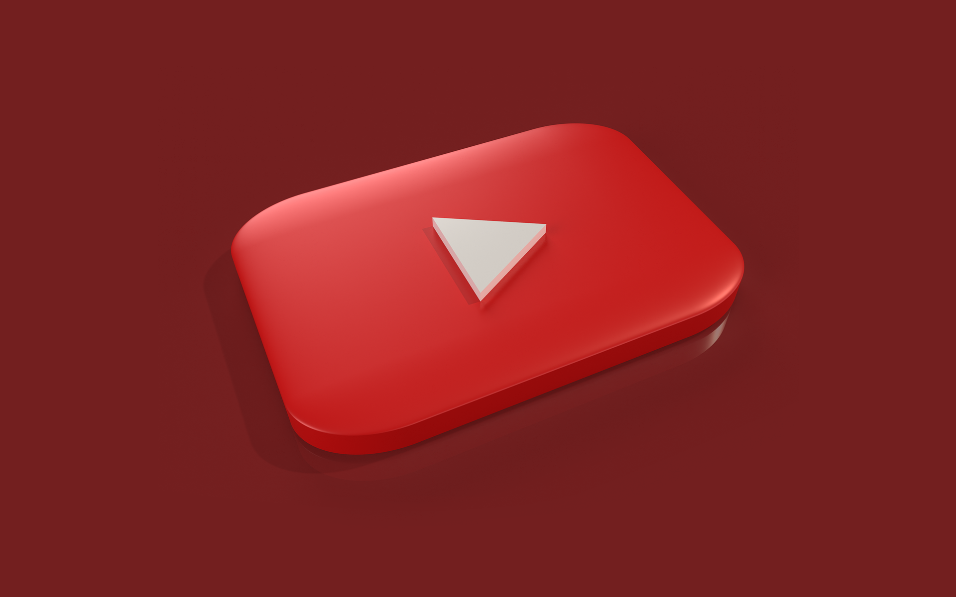 YouTube Play button on a red surface